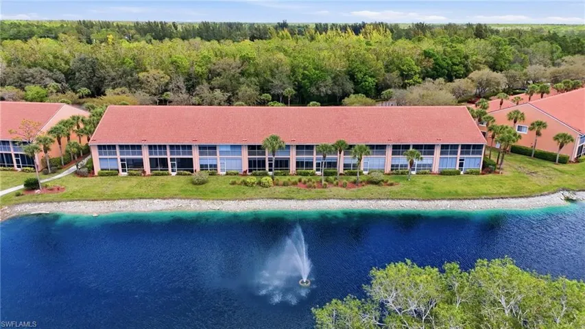 Bird's eye view of a nearby body of water and a heavily wooded area