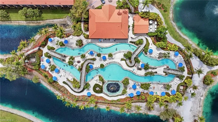 Drone / aerial view of a large body of water and a pool area