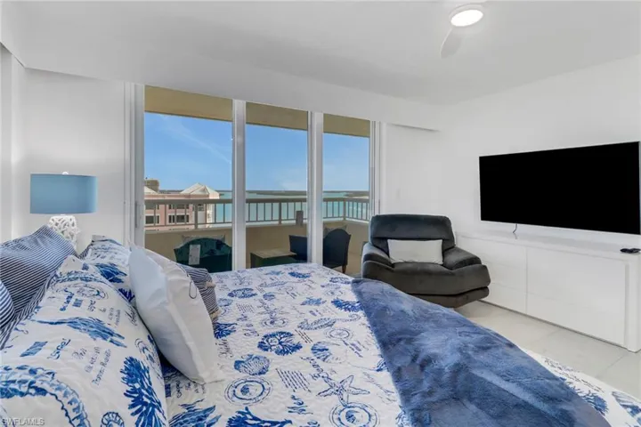 Bedroom featuring ceiling fan and access to exterior