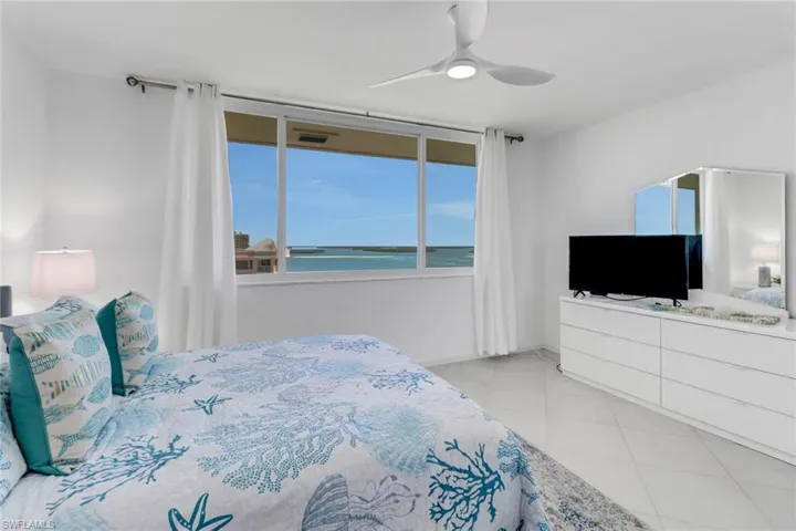 Bedroom featuring a ceiling fan and light tile patterned floors