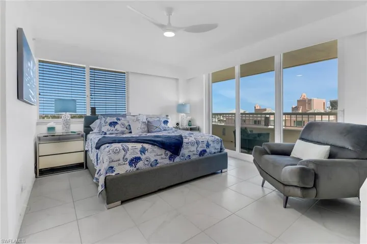 Bedroom featuring ceiling fan and access to exterior