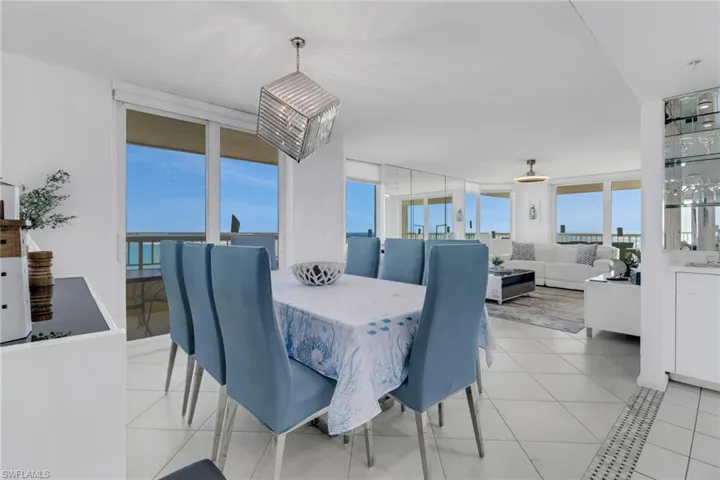 Dining space with light tile patterned floors