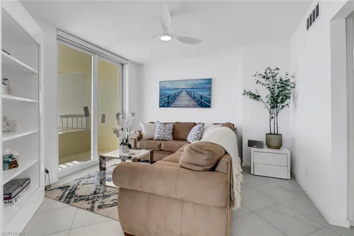Living area featuring ceiling fan