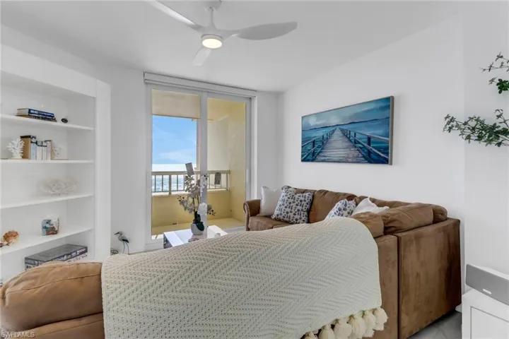 Bedroom featuring access to exterior and ceiling fan