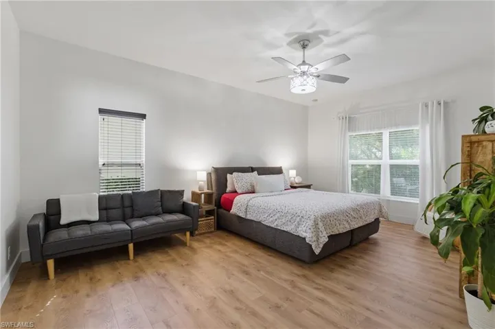 Bedroom featuring wood finished floors and a ceiling fan
