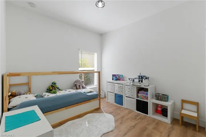 Bedroom with light wood finished floors