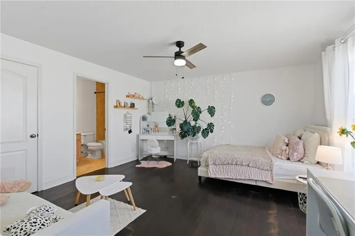 Bedroom with wood finished floors and a ceiling fan