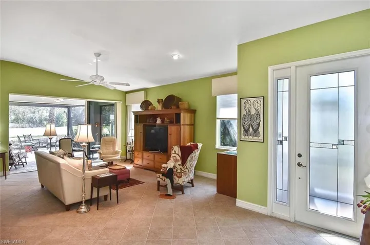 Spacious tiled Gathering Room with vaulted ceiling and sliders to the Lanai
