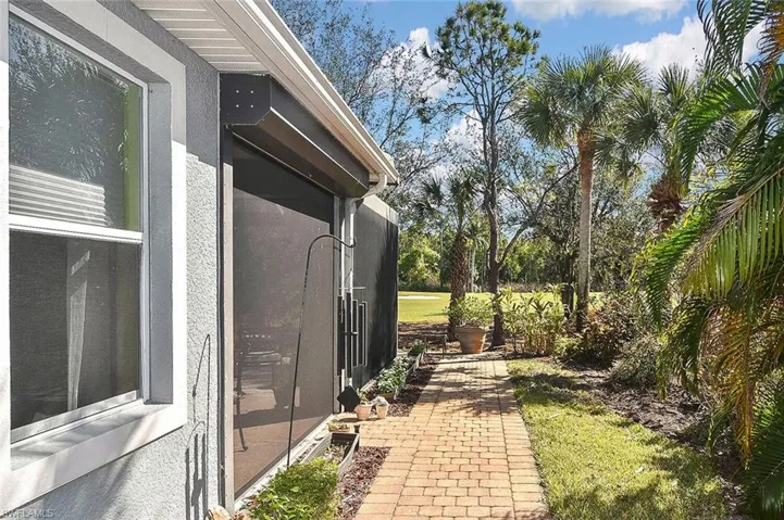 Paver walkway surrounds this home allowing you to enjoy more time in the green space
