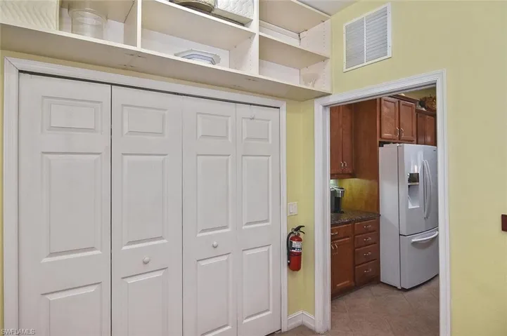 Laundry Room has a double closet to help store groceries and special items