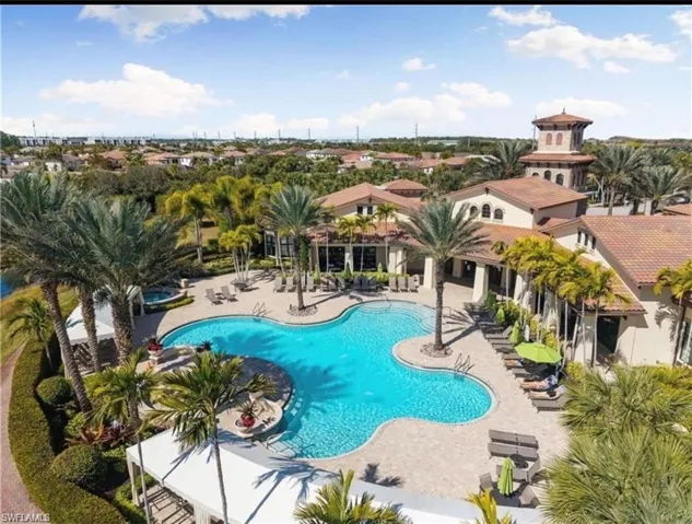 Community pool featuring a patio area