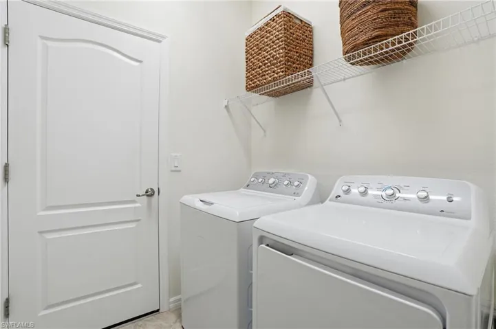 Laundry room with washing machine and dryer
