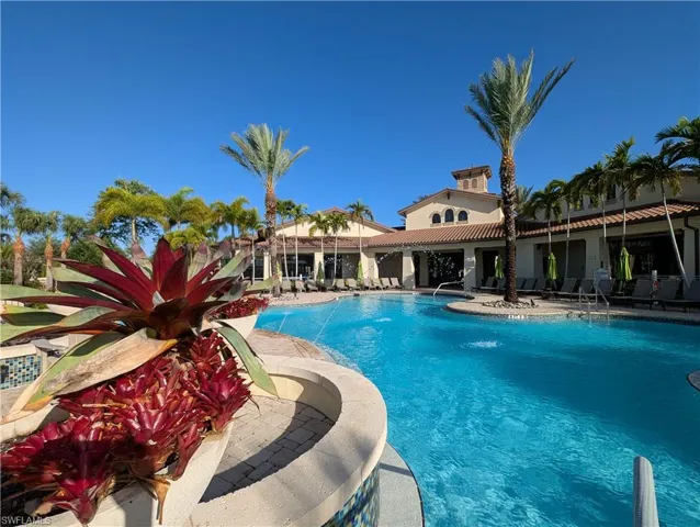 Community pool with a patio