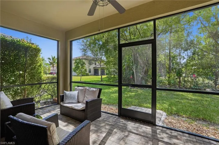 Sunroom / solarium featuring ceiling fan and outdoor lounge area