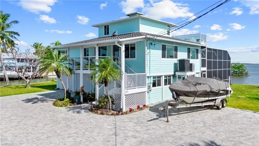 Front of property featuring a water view VIRTUALLY ENHANCED