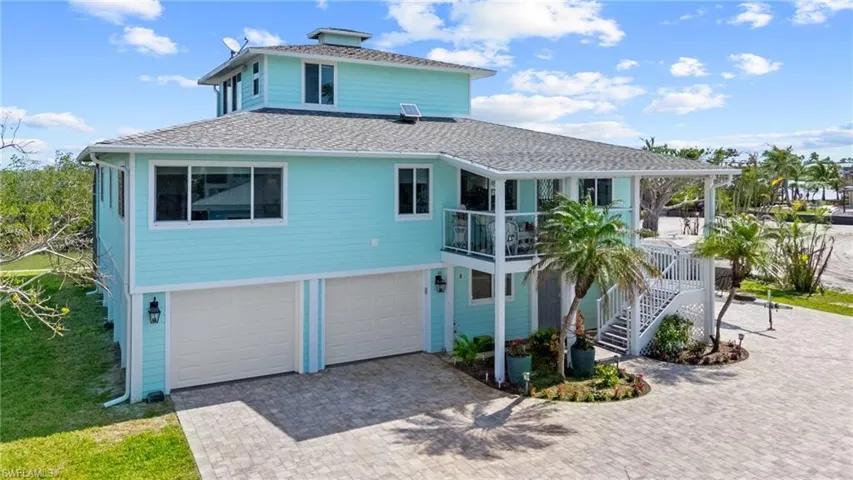 View of front facade with a garage Virtually enhanced