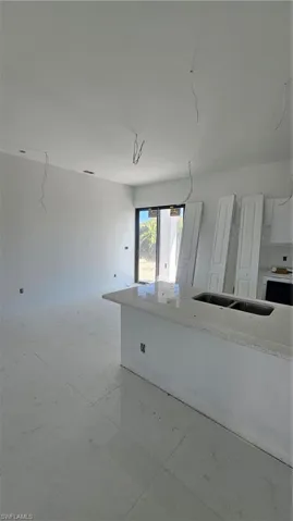 Unfurnished room featuring a sink