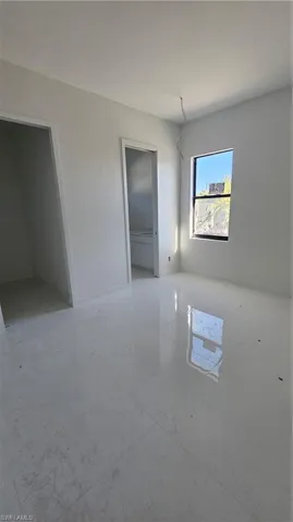 Spare room featuring baseboards