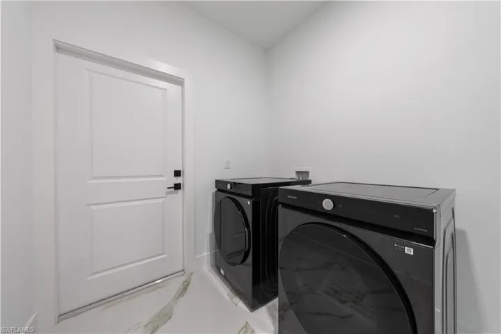 Washroom with laundry area and independent washer and dryer