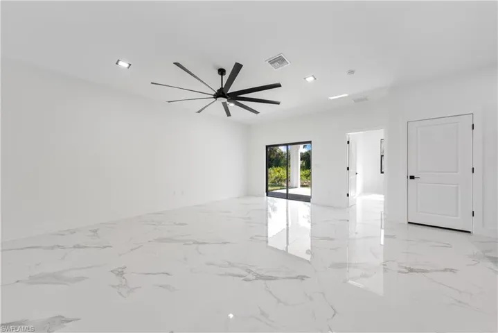 Unfurnished room with recessed lighting, visible vents, marble finish floor, and ceiling fan