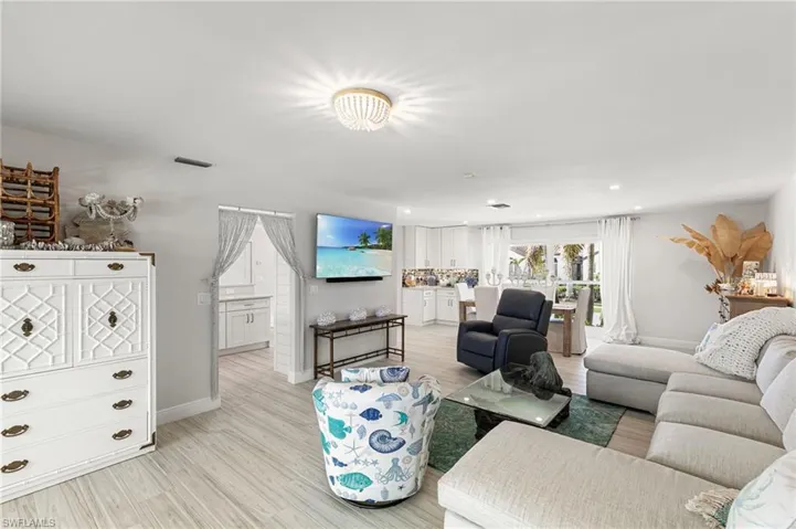 Living area featuring baseboards and wood finished floors