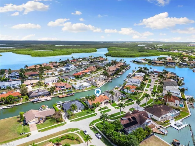 Aerial perspective of suburban area with a large body of water