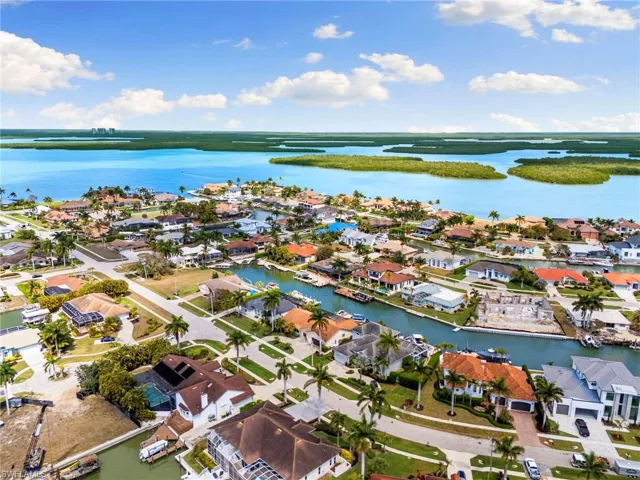 Aerial view of residential area with a large body of water
