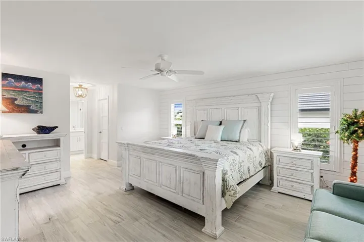 Bedroom with ceiling fan and light wood finished floors