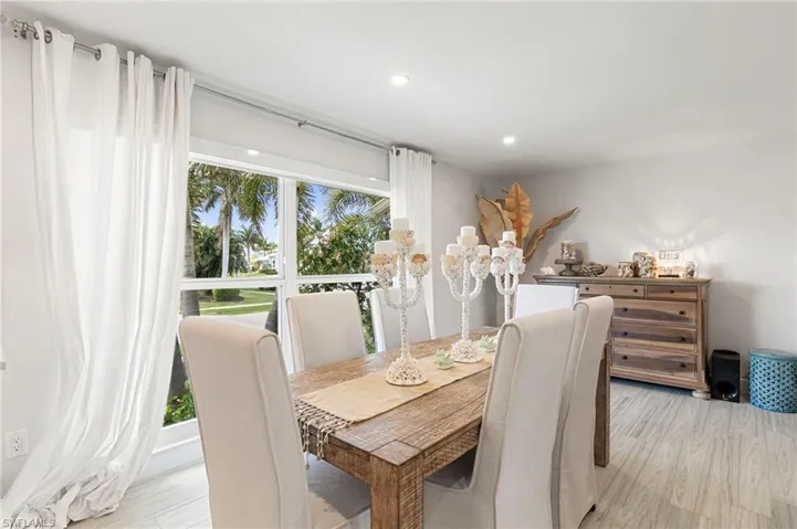 Dining space featuring light wood-type flooring and recessed lighting