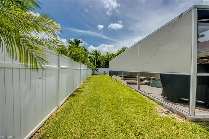 View of yard featuring a fenced in pool