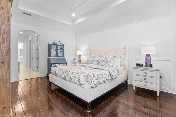 AMAZINGLY BEAUTIFUL TRUE WOOD FLOORING IN THIS HUGE MASTER SUITE PLUS THE BED REMAINS FOR YOUR ENJOYMENT!