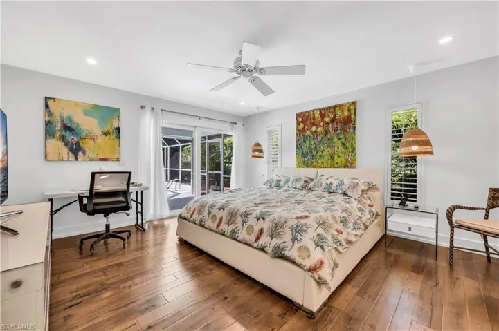 Bedroom with access to exterior, dark wood-style flooring, a desk, ceiling fan, and recessed lighting