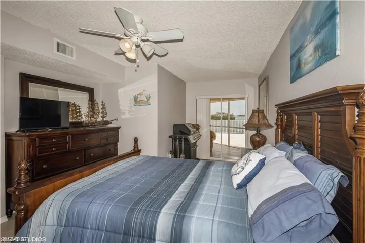Guest bedroom also with sliders out to the balcony and bay views!