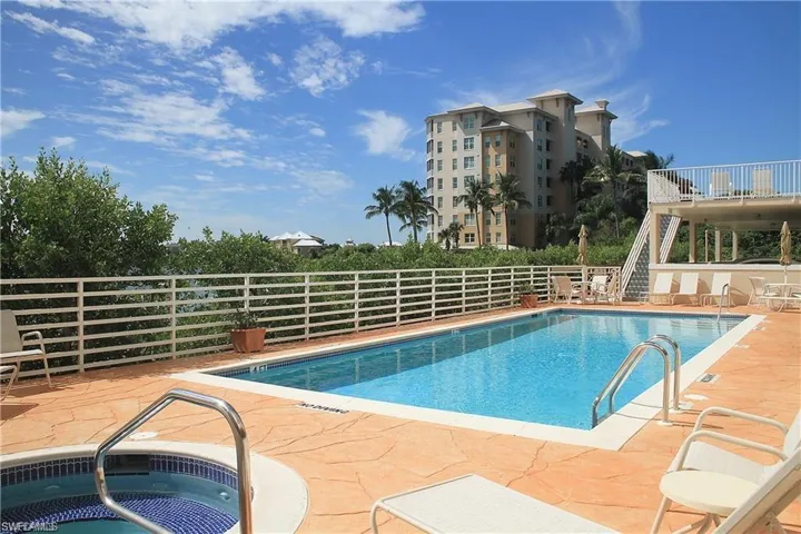 This is an older picture of the pool-it has just been refurbished with pavers around the deck. Stairs lead up to the community BBQ area complete with restrooms.