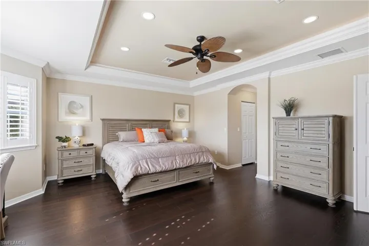 Tray ceiling with recessed lighting and crown molding