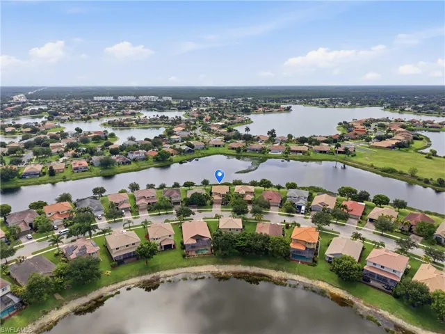 Aerial perspective showcasing a residential community with multiple lakes
