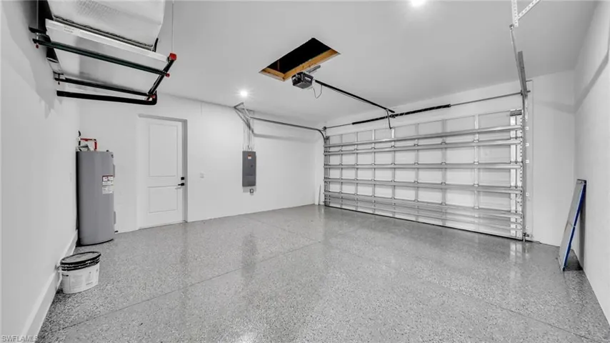 Garage with electric water heater and electric panel