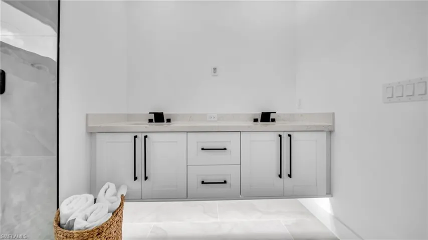 Bathroom featuring double vanity