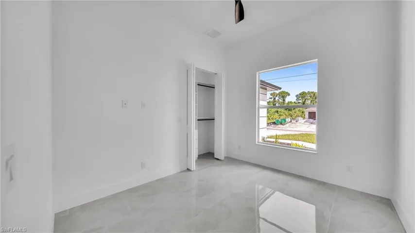 Unfurnished bedroom with baseboards