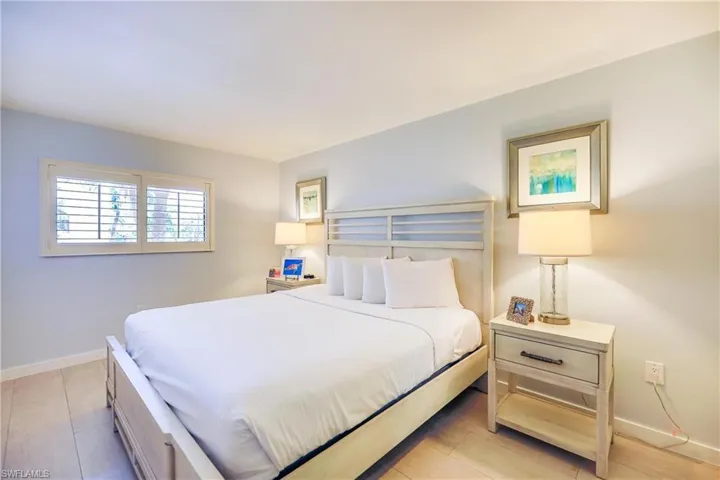 Bedroom featuring baseboards and light wood finished floors