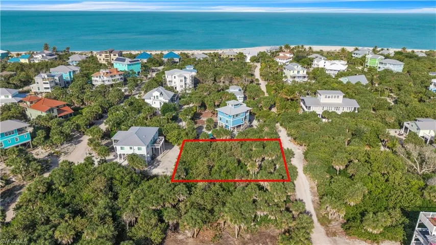 Aerial view of 4521 Oro Pesos Lane (outlined in red) — nestled among established island homes on North Captiva, with the Gulf of Mexico visible just steps away.