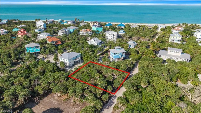 Aerial view of 4521 Oro Pesos Lane (outlined in red) — nestled among established island homes on North Captiva, with the Gulf of Mexico visible just steps away.