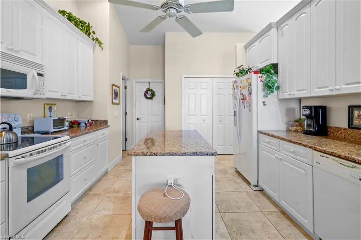Kitchen features an island, large pantry, laundry room and 3 ar garage enterences.