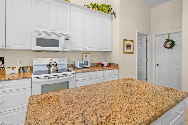 Kitchen has an island and a penninsula. It's a very well laid out kitchen! With a lot of counter space for cooking with friends and family!