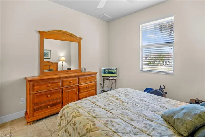 Both guest bedrooms are nice sized 12' x 11' with walk- on closets, ceiling fans, 2" white blinds, light patterned 20" porcelain floor tile and 5 3/4" baseboards.