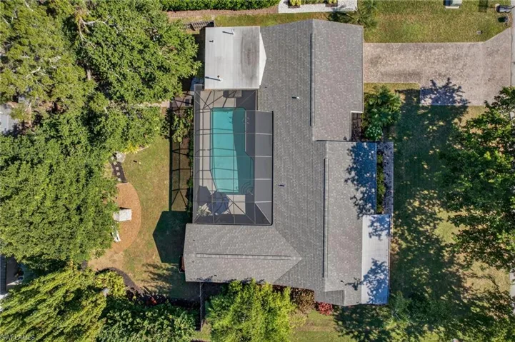 View of subject property with a pool area