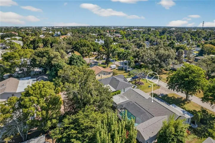 Aerial view of residential area with a tree filled landscape