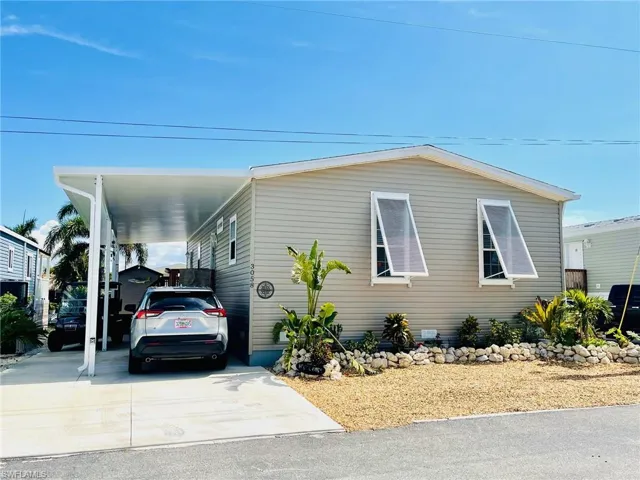 View of front of home with a carport