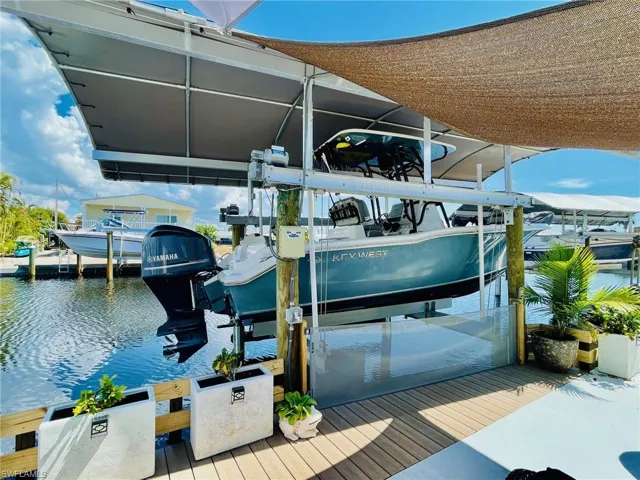 Dock area featuring a water view