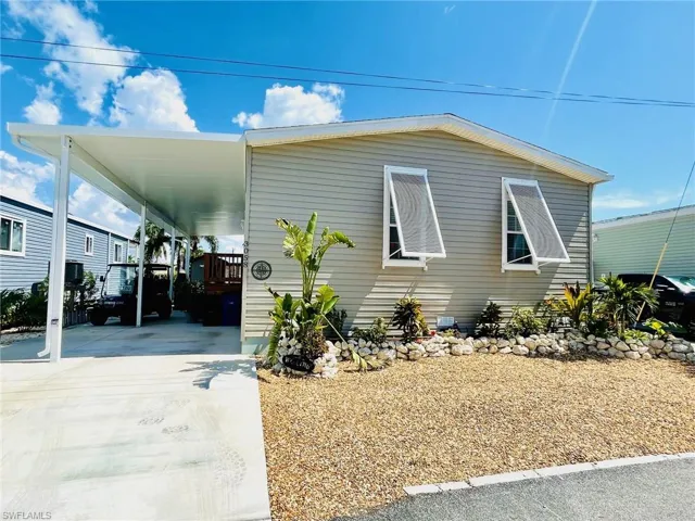 View of home's exterior featuring a carport